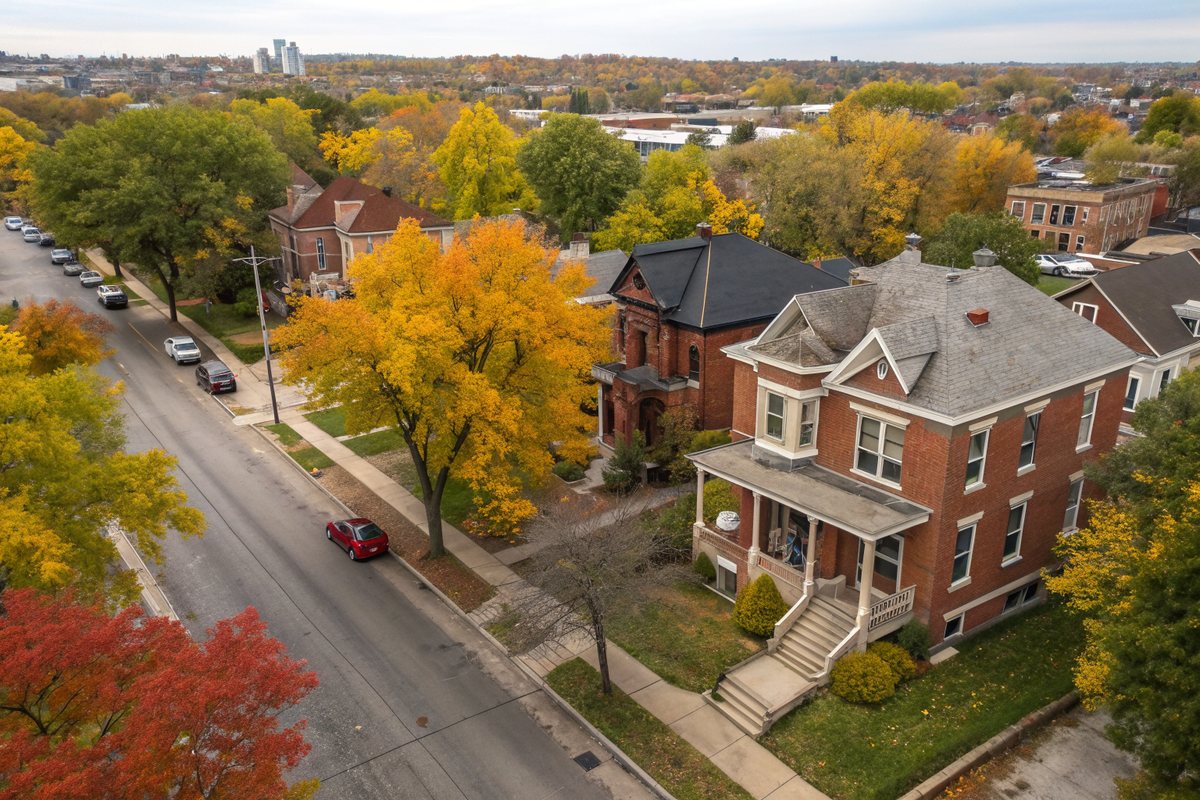 Aerial view of tree-lined streets of older brick and frame houses